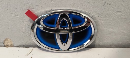 7540348010 - ЭМБЛЕМА КАПОТА TOYOTA CAMRY PRIUS