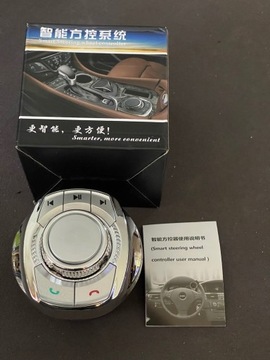 Джойстик iDrive в підстаканнику з багатонаправленими функціями.