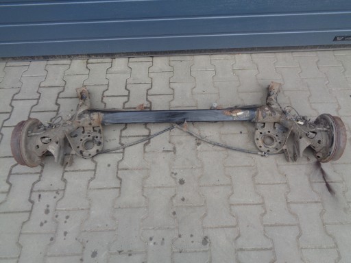 Toyota yaris ii задня балка моста з барабанами